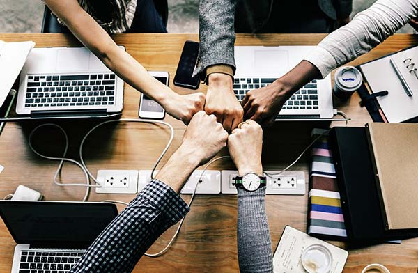 5 Work Colleagues Fistpumping