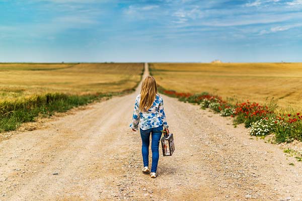 Girl Walking Carrying Suitcase