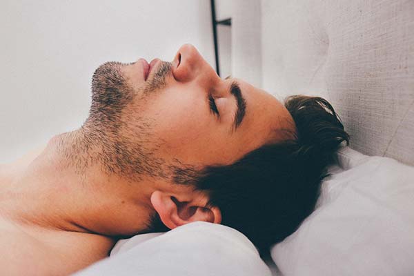 Man Sleeping with Neck Support