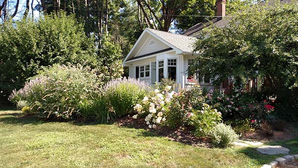 House with Beautiful Flowered Front Yard