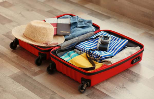 Open Suitcase Packed with Clothes