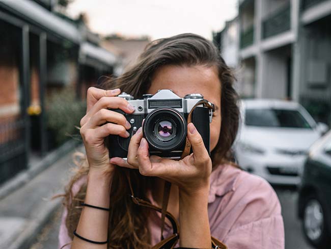 Girl Using SLR Camera