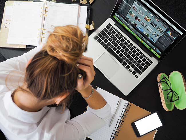 Young Girl Struggling on Laptop