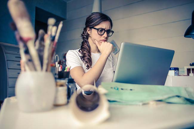 Confused Looking Woman Using Laptop