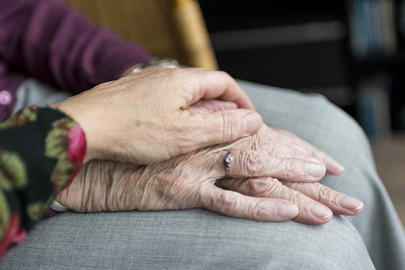 Holding an Elderly Lady's Hand