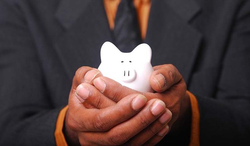 Piggy Bank Held in Cupped Hands