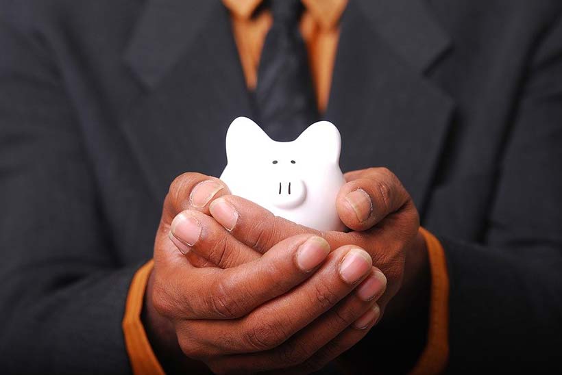 Piggy Bank Held in Cupped Hands