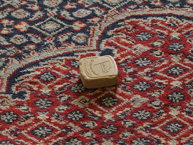 Prayer Stone on Persian Rug