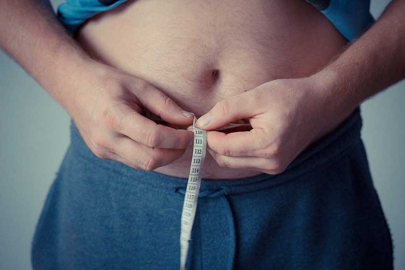 Man Measuring Waistline