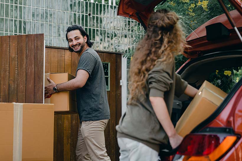 Couple Unloading Car