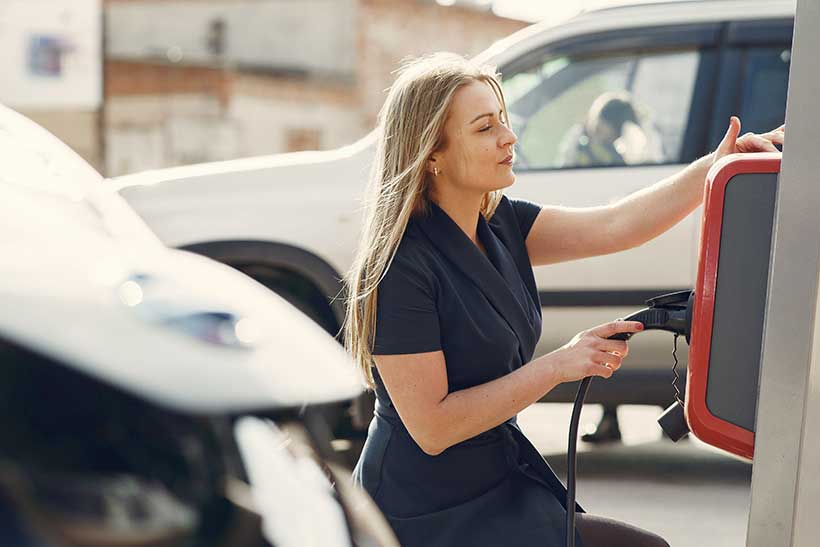 Woman Using EV Chargepoint